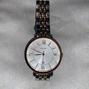 Silver and rose gold medal fossil watch